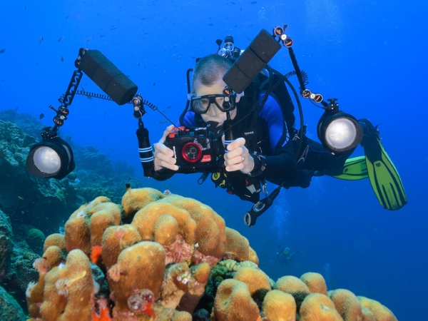 Diver with a balanced underwater camera setup